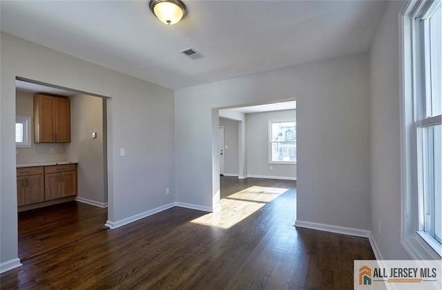 interior space with dark hardwood / wood-style floors