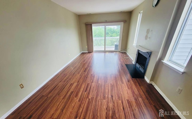2910 Jesse Way, Piscataway, NJ 08540 - unfurnished living room with a fireplace with flush hearth and dark wood finished floors