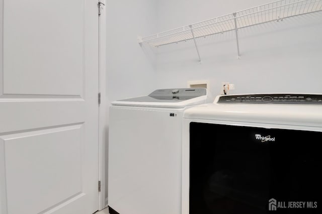 washroom featuring independent washer and dryer