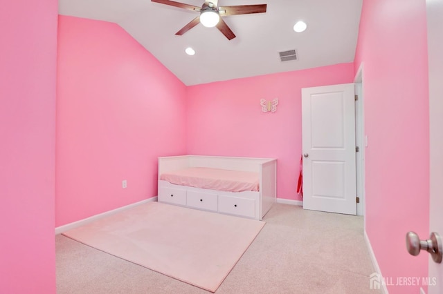 unfurnished bedroom featuring lofted ceiling, carpet, recessed lighting, baseboards, and ceiling fan