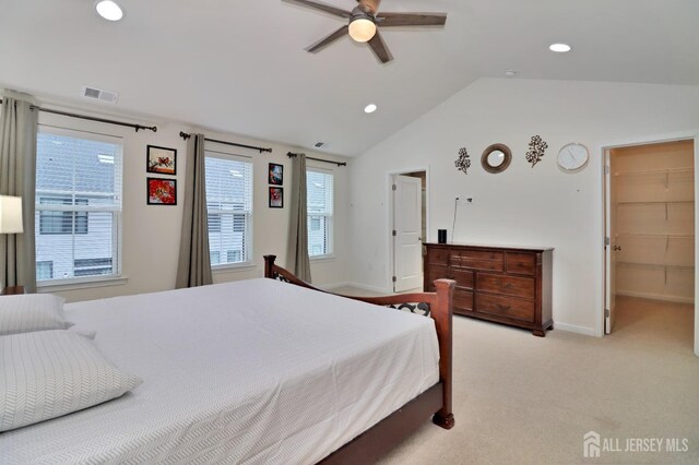 bedroom featuring recessed lighting, vaulted ceiling, light carpet, multiple windows, and baseboards