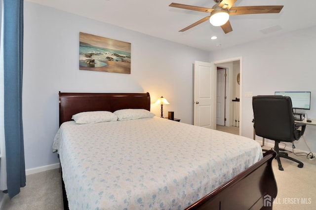 bedroom with light colored carpet, recessed lighting, baseboards, and a ceiling fan