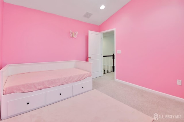 carpeted bedroom with lofted ceiling, recessed lighting, and baseboards