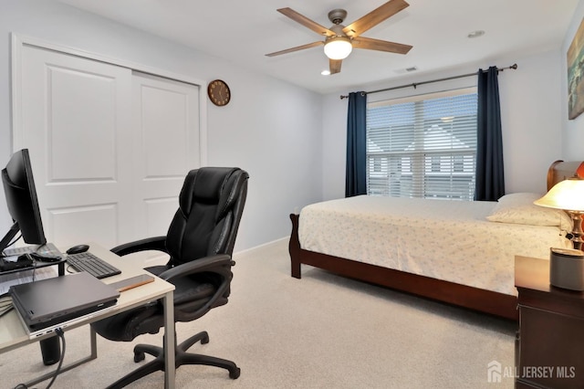 carpeted bedroom with a desk, ceiling fan, and baseboards