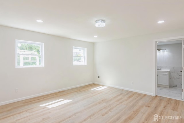 17-1/2 Thomas St, South River, NJ 08882 - unfurnished bedroom with multiple windows, light wood-style floors, recessed lighting, and ensuite bathroom