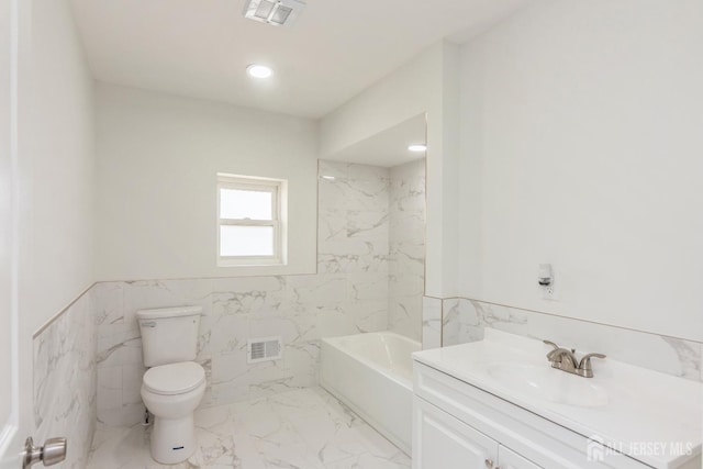 17-1/2 Thomas St, South River, NJ 08882 - bathroom with tile walls, marble finish flooring, vanity, and wainscoting