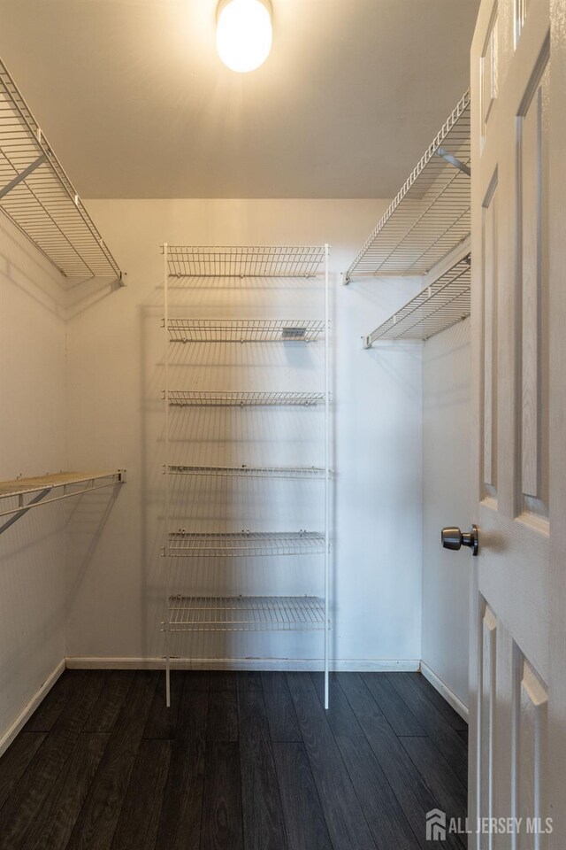 20 S So 8th Ave, Manville, NJ 08835 - spacious closet with dark wood-style floors