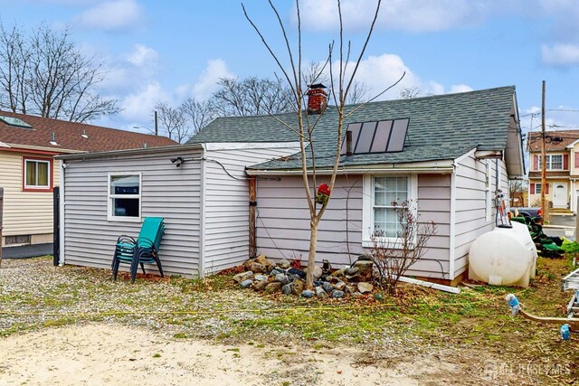 20 S So 8th Ave, Manville, NJ 08835 - back of property with roof with shingles and a chimney