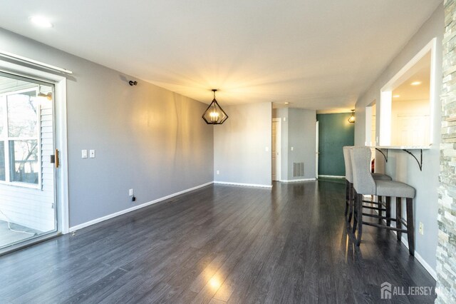 20 S So 8th Ave, Manville, NJ 08835 - dining area featuring dark wood-type flooring, baseboards, and a chandelier