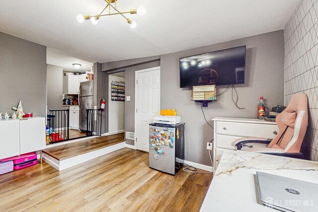 20 S So 8th Ave, Manville, NJ 08835 - interior space with a chandelier, wood finished floors, and baseboards