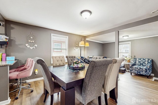 20 S So 8th Ave, Manville, NJ 08835 - dining room featuring wood finished floors, baseboards, and crown molding