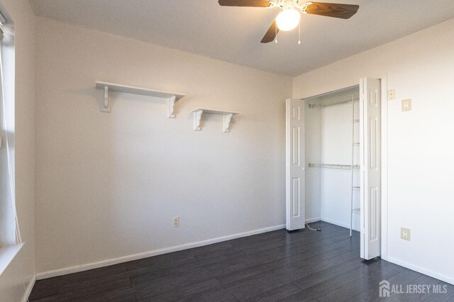 20 S So 8th Ave, Manville, NJ 08835 - unfurnished bedroom with dark wood finished floors, baseboards, a ceiling fan, and a closet