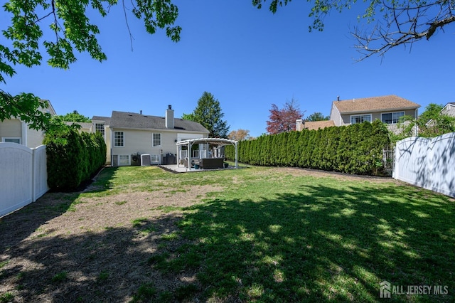 view of yard with a fenced backyard, a patio area, and a pergola