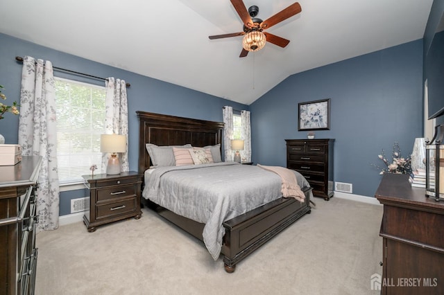 bedroom featuring baseboards, vaulted ceiling, and light carpet