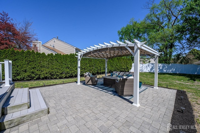 view of patio / terrace with a fenced backyard, a pergola, and an outdoor living space