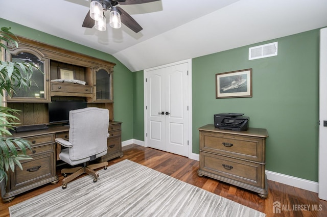 office featuring a ceiling fan, baseboards, visible vents, and vaulted ceiling