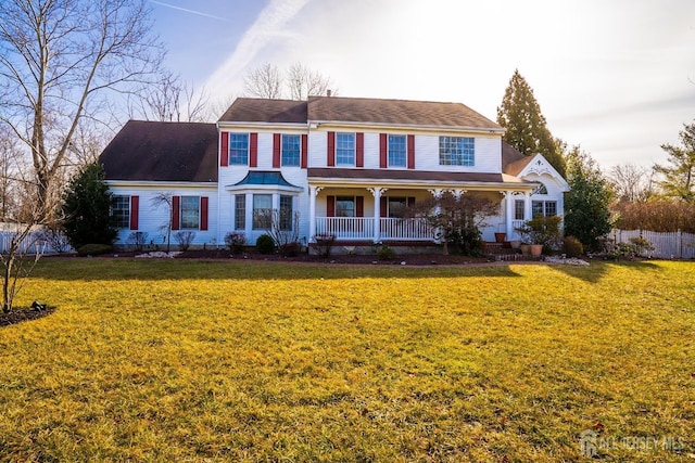 view of front of property with a front lawn and covered porch