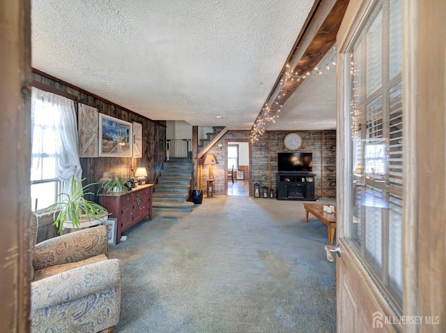 36 Frederick St, Carteret, NJ 07008 - living room featuring a textured ceiling, stairs, carpet, and wooden walls