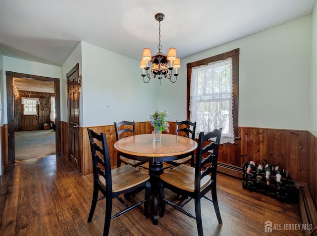36 Frederick St, Carteret, NJ 07008 - dining area featuring wainscoting, wood finished floors, a chandelier, wooden walls, and baseboard heating