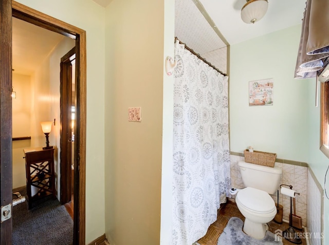 36 Frederick St, Carteret, NJ 07008 - full bathroom with a wainscoted wall, curtained shower, and tile walls