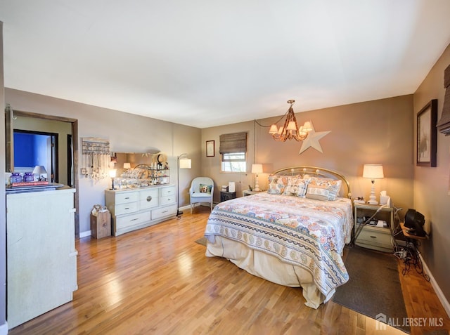 36 Frederick St, Carteret, NJ 07008 - bedroom with wood finished floors and a chandelier