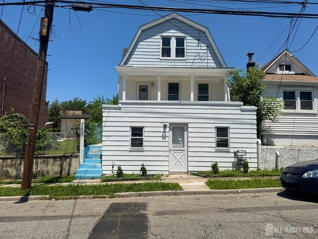 360 Alpine St, Perth Amboy, NJ 08861 - colonial inspired home featuring a gambrel roof