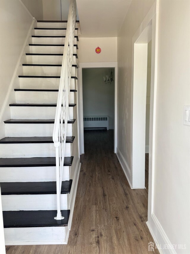 360 Alpine St, Perth Amboy, NJ 08861 - staircase featuring wood finished floors and radiator heating unit