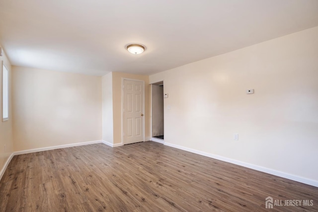 360 Alpine St, Perth Amboy, NJ 08861 - empty room with baseboards and wood finished floors