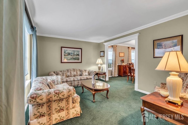 living room featuring carpet, baseboards, and ornamental molding