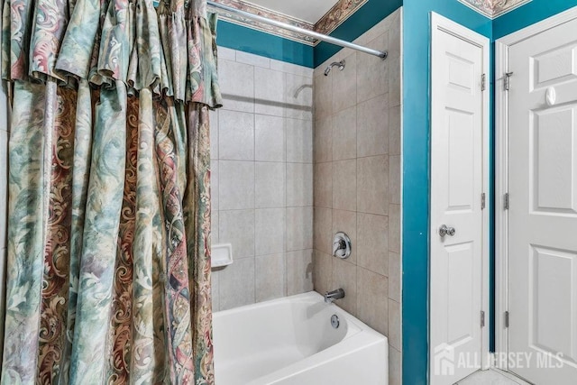 full bathroom featuring shower / bath combination with curtain
