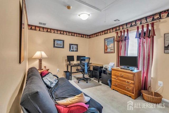 office space featuring attic access, carpet floors, and visible vents