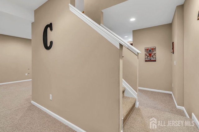stairs featuring recessed lighting, baseboards, and carpet