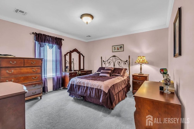 carpeted bedroom featuring crown molding and visible vents