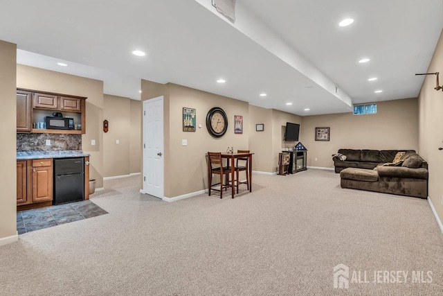 living room with light carpet, baseboards, and recessed lighting