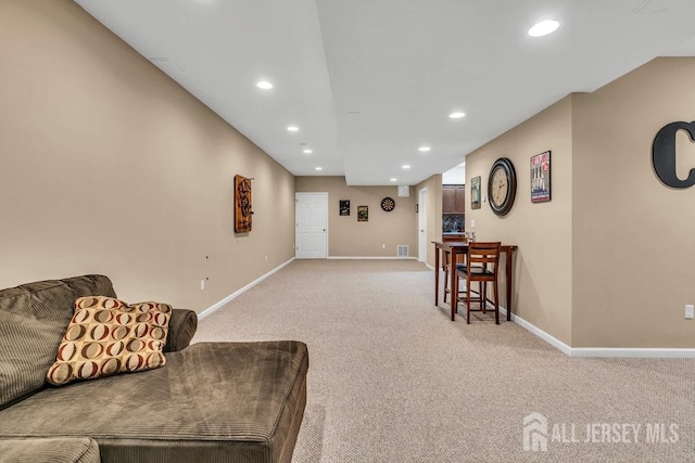 living room with light colored carpet, baseboards, and recessed lighting