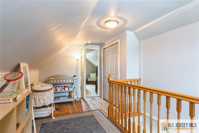 5 Channing Rd, East Brunswick, NJ 08816 - corridor featuring hardwood / wood-style floors, vaulted ceiling, and an upstairs landing