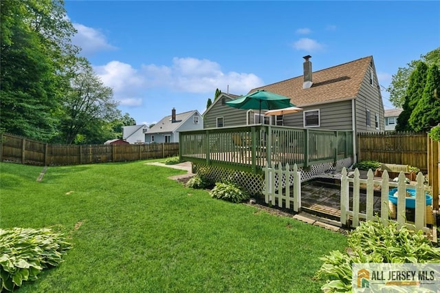 5 Channing Rd, East Brunswick, NJ 08816 - fenced backyard with a wooden deck