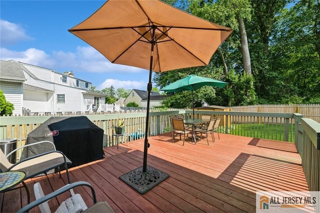 5 Channing Rd, East Brunswick, NJ 08816 - deck featuring a fenced backyard, outdoor dining space, and a grill