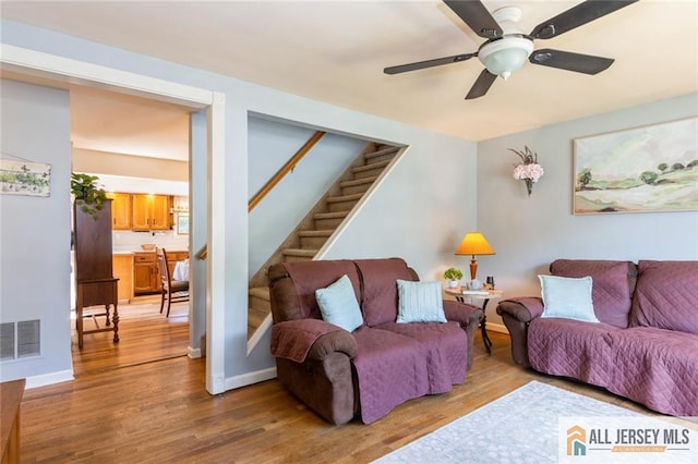 5 Channing Rd, East Brunswick, NJ 08816 - living room with wood finished floors, stairs, and ceiling fan