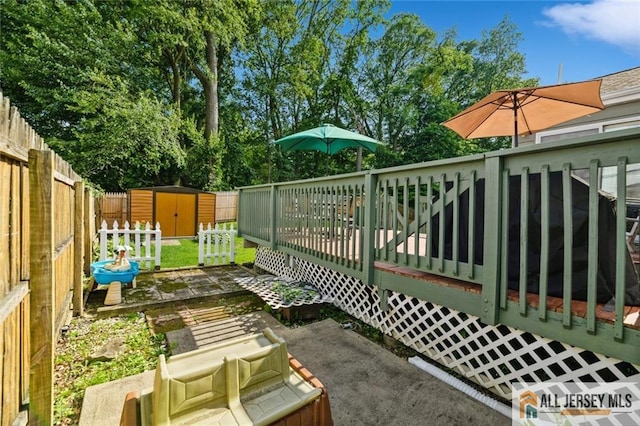 5 Channing Rd, East Brunswick, NJ 08816 - fenced backyard featuring a storage shed and a deck