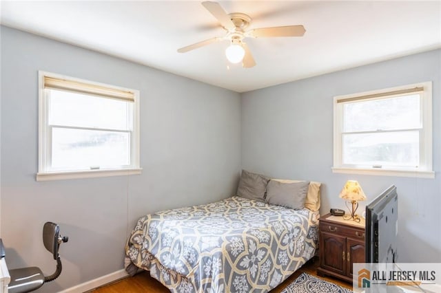 5 Channing Rd, East Brunswick, NJ 08816 - bedroom featuring multiple windows, wood finished floors, and a ceiling fan