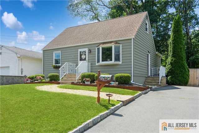 5 Channing Rd, East Brunswick, NJ 08816 - view of front of property featuring asphalt driveway, a front yard, and roof with shingles