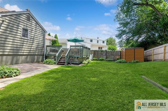 5 Channing Rd, East Brunswick, NJ 08816 - fenced backyard with a deck and a storage shed