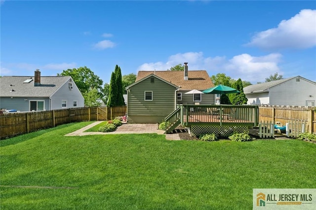 5 Channing Rd, East Brunswick, NJ 08816 - rear view of house with a fenced backyard and a deck