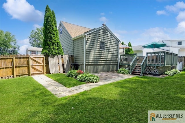 5 Channing Rd, East Brunswick, NJ 08816 - rear view of house with a wooden deck and a gate