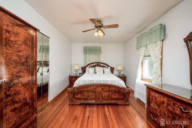 1909 Hamilton Blvd, South Plainfield, NJ 07080 - bedroom with wood finished floors, a ceiling fan, and radiator heating unit