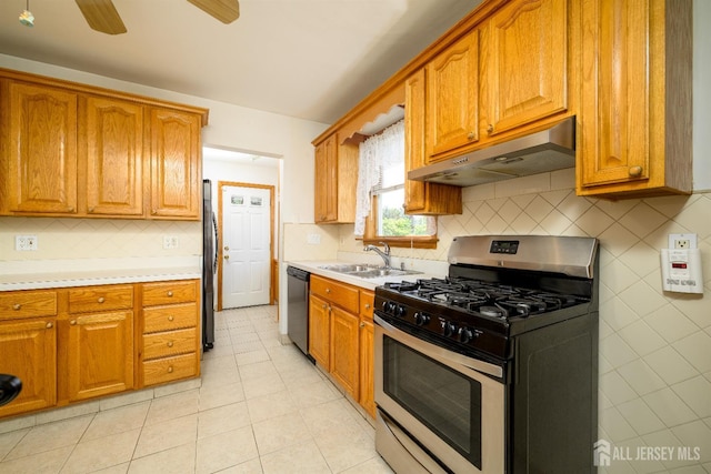 1909 Hamilton Blvd, South Plainfield, NJ 07080 - kitchen with appliances with stainless steel finishes, under cabinet range hood, a sink, and light countertops