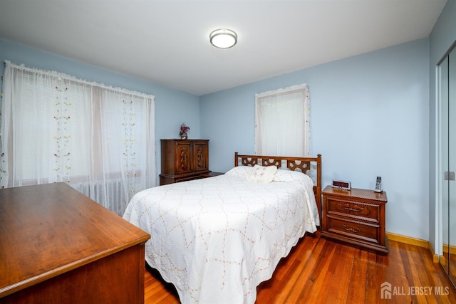 1909 Hamilton Blvd, South Plainfield, NJ 07080 - bedroom with dark wood finished floors, baseboards, and a closet