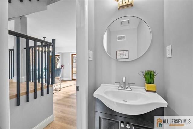 bathroom featuring hardwood / wood-style floors and vanity