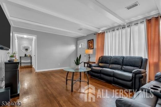 27 6th Ave, Port Reading, NJ 07064 - living room featuring beam ceiling and wood finished floors